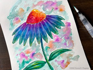 A painting of a cone flower painted in bright, washy colors and pen. A water brush sits next to it on a table. Art by Victoria K. Chapman.